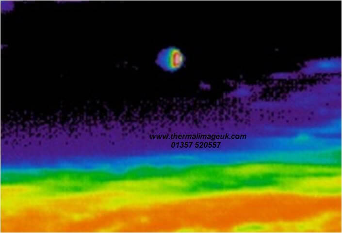 Photo of a thermal imaging camera showing the dark side of the moon