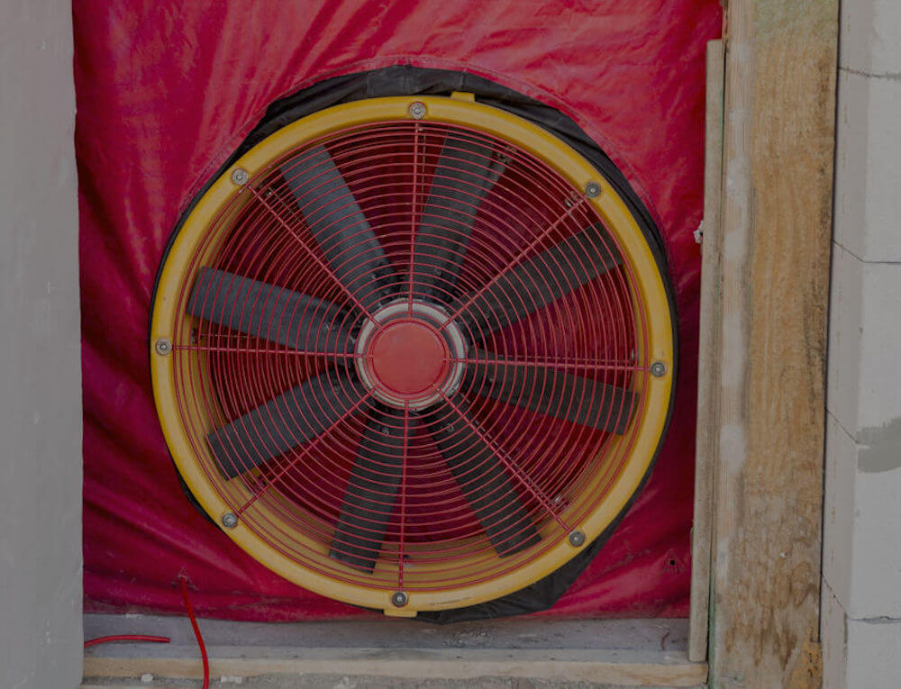 Air tightness testing fan in doorway